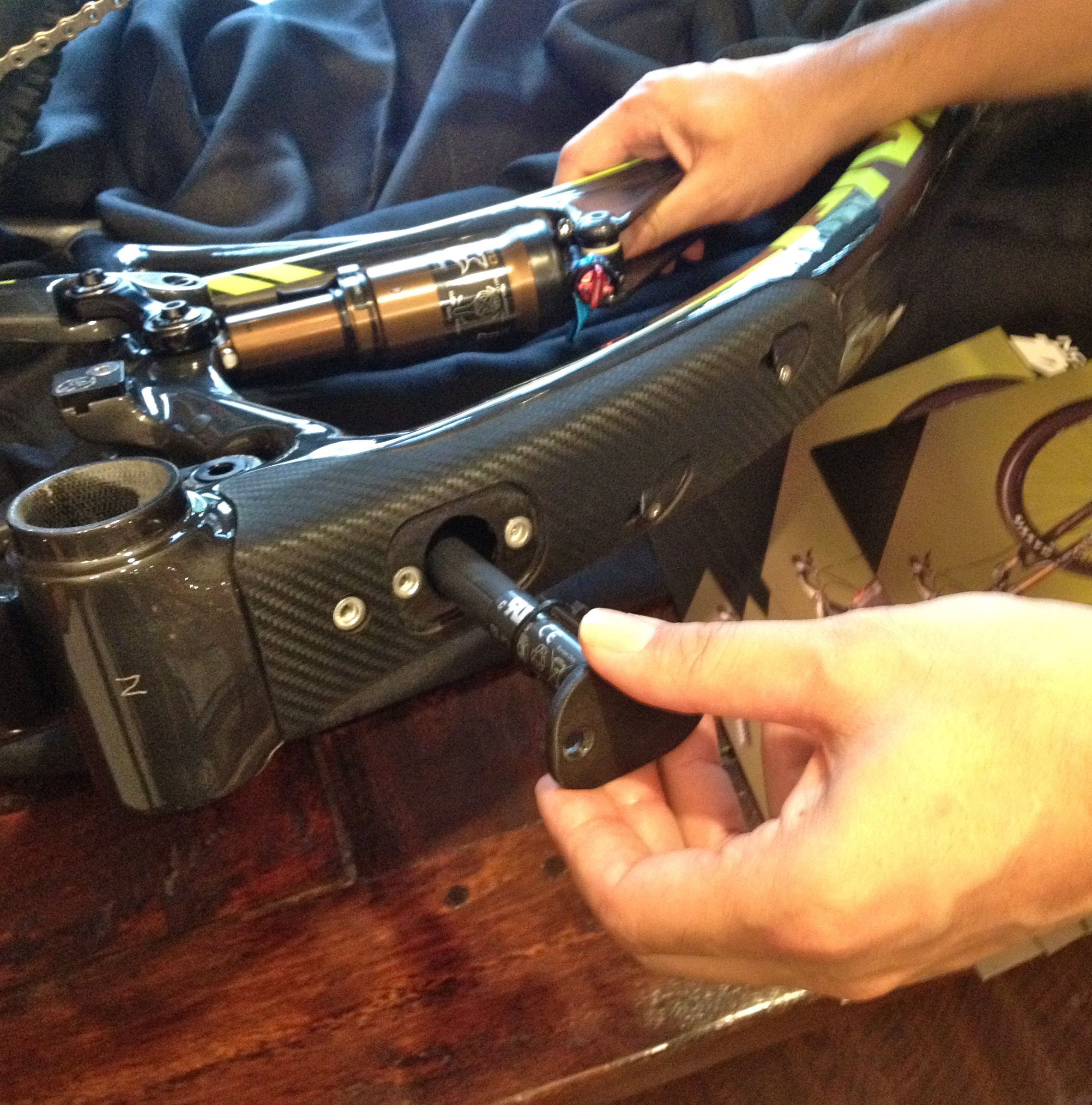 Pivot's Chris Cocalis demonstrates how to stow the Di2 battery inside the Mach 4's via the frame's downtube port. 