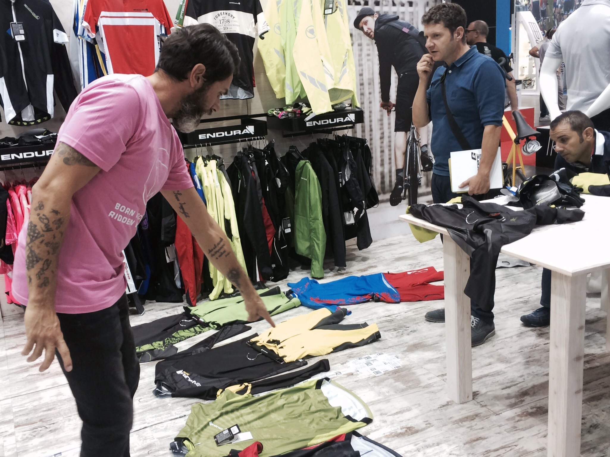 Business is done, too. Here an Endura sales rep shows the line to an Italian retailer.