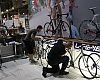SBS employees set up and clean bikes for Wednesday's show opening. Photo: Steve Frothingham
