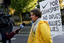 Paul Willerton, a former pro racer and executive at DeFeet International, speaks to the media outside Nike headquarters Tuesday. Photo: Pat Malach.