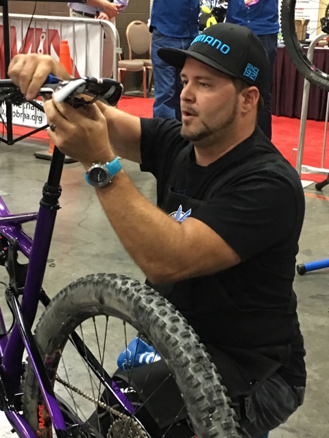 Shawn Miller changes a saddle on Thursday.