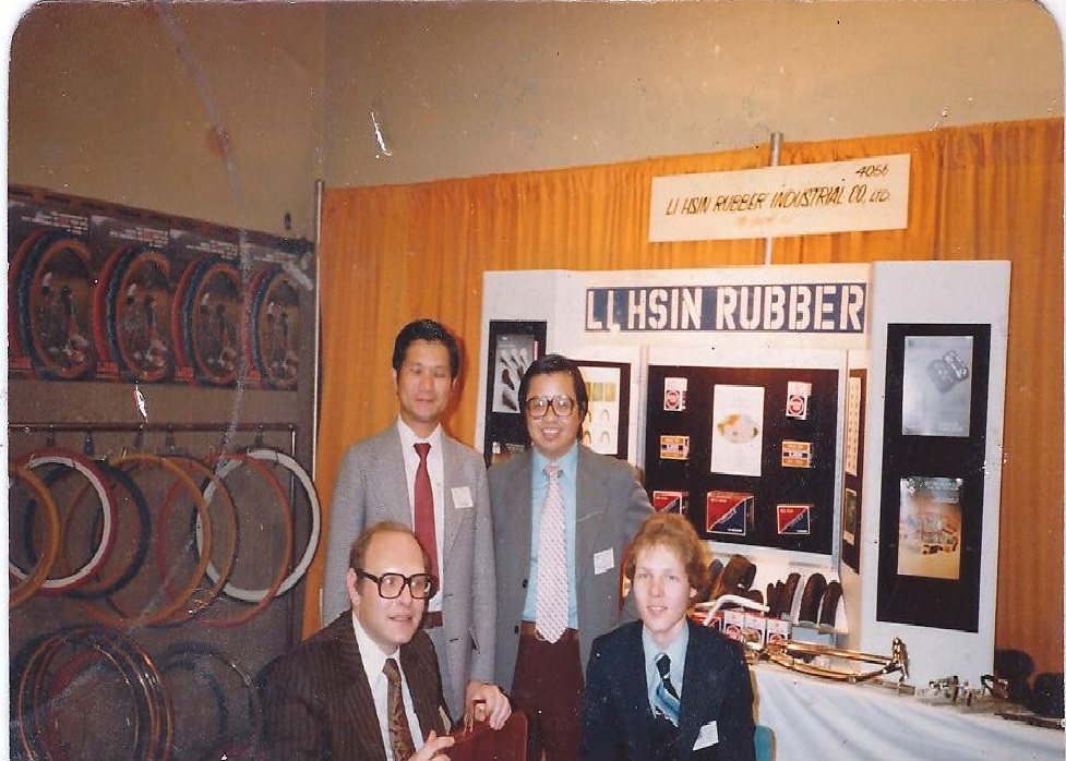 Bob Fluhr, bottom left, with son Steven at the 1980 New York bike show. The man standing on the left is Mark Tsai, the owner of Li Hsin Rubber and the other man is Joe Hwang, then the sales manager for LHR USA.