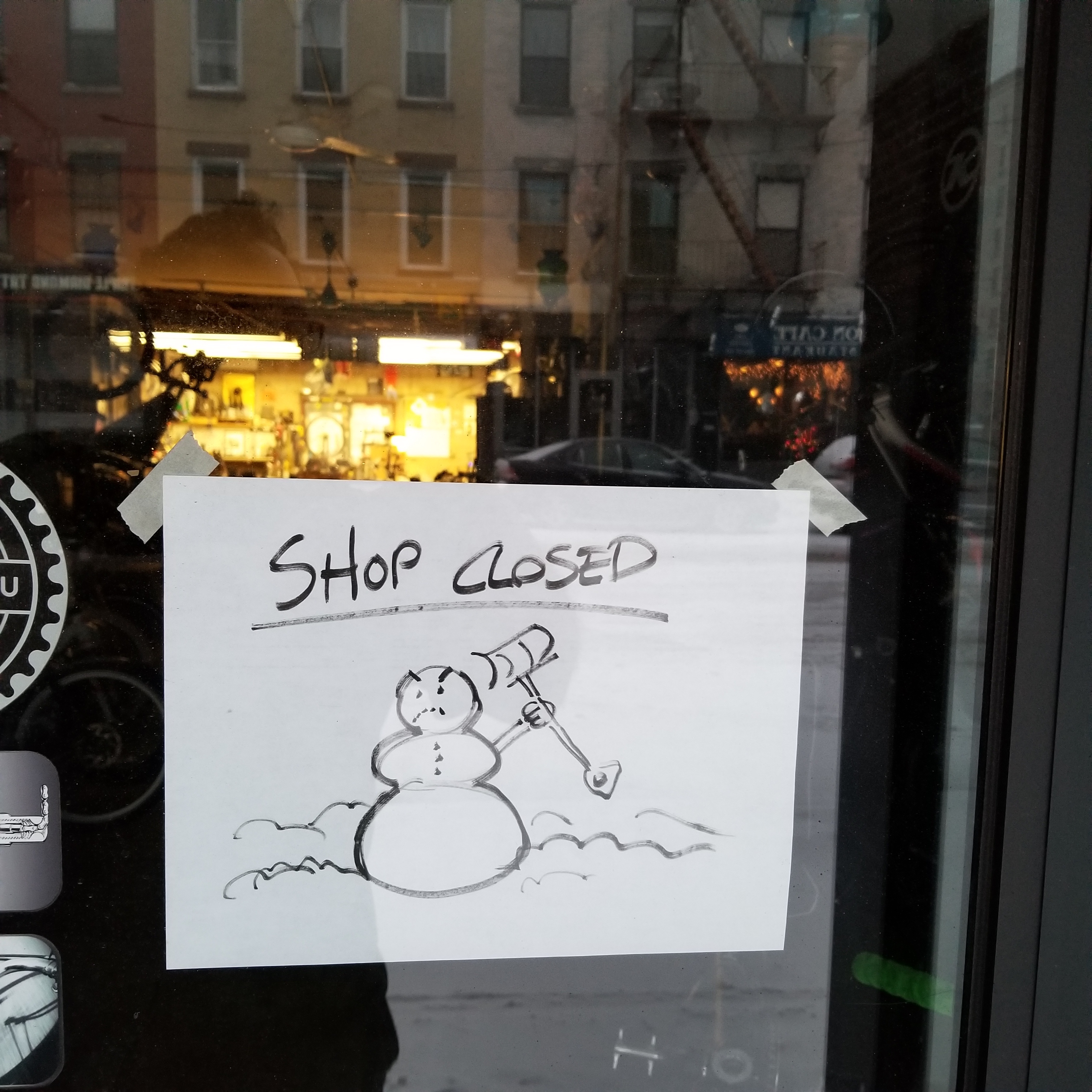 A mad snowman greets customers at 718 Cyclery.