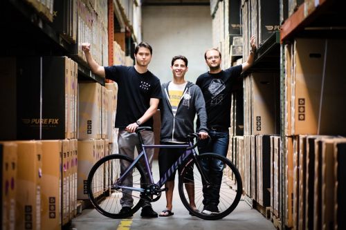 Fishman (center) is president and co-founder of Pure Cycles.