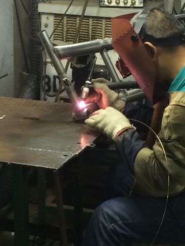 A welder at a Taiwanese bike factory. BRAIN photo.