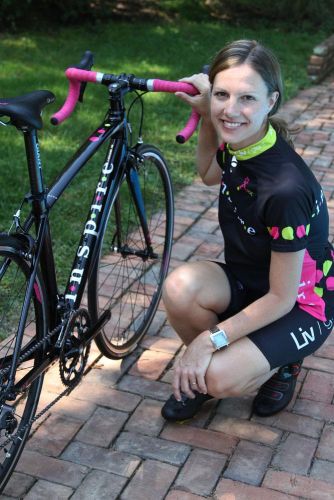 Breast cancer survivor Emily Gresh with the 2012 Liv/giant Avail Inspire she designed.