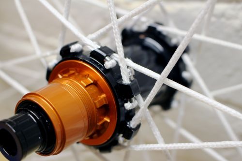 The Berd spokes work with hubs designed for J-bend or straight-pull metal spokes.