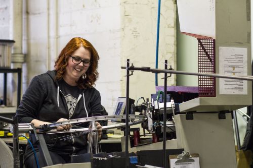 A wheel is built at the Detroit Bikes factory.