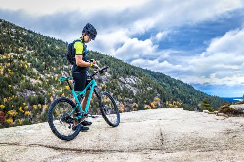 The Fenix 5 shown in use by a mountain biker.