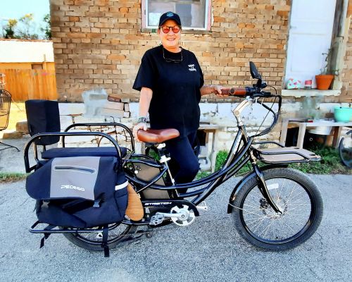 Kristen Pokky rides a Pedego Stretch to keep her active while battling a muscular disease.