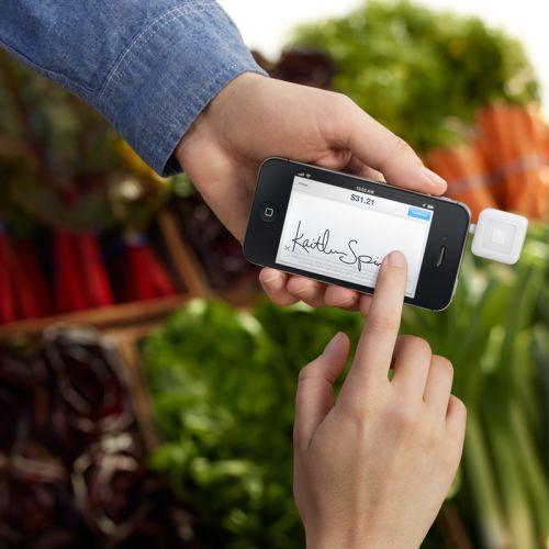 The Square register app and card scanner on an iPhone