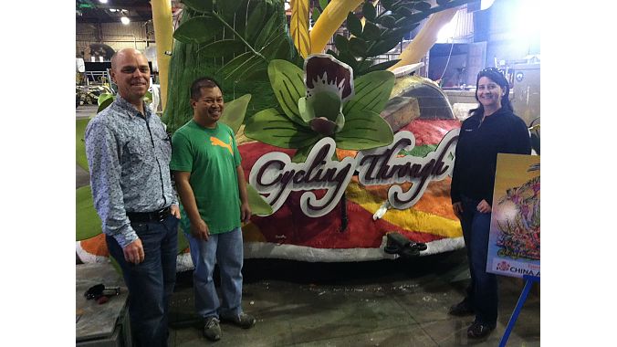Brad Klipping, Giant USA Marketing Manager (far left) and Benson Lam, owner of Jones Bicycles II in San Marino, CA, get a sneak-peek of the China Airlines float before the 2013 Rose Parade.  On the right is Giant USA Marketing Project Manager Deanne Wilson, who organized the bicycles and riders who will pedal Giant and Liv/giant bicycles alongside the float. 