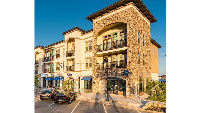 Outside Giant Lakeside in Flower Mound, TX. The business occupies the ground floor in one of the upscale residential/commercial spaces in The Shops at Lakeside.