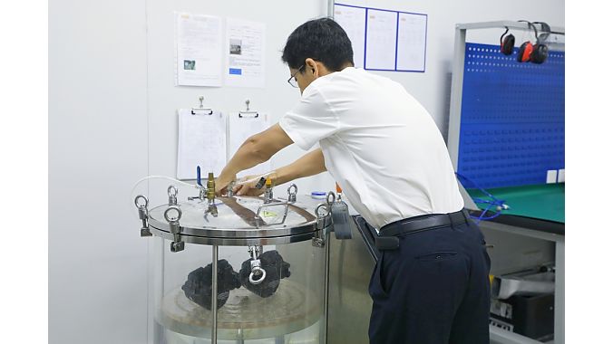 An engineer operating the air tightness tester