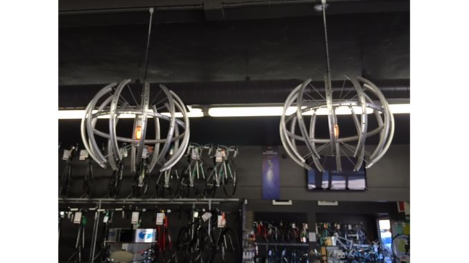 The store designer at I. Martin chopped up rims to make these chandeliers and hung them with bike chains above the cash wrap at the front of the store.