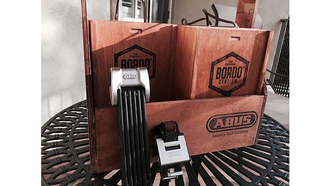 Abus' Bordo Centium stainless-steel lock comes in a wooden box. Retailers ordering four locks receive a wooden tool box for display.