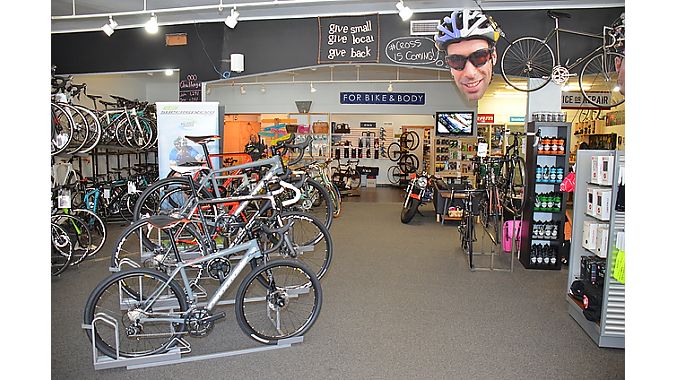 When Ben Cooley bought Bicycle Sport Charlotte in 2011, it was road centric. “It was a bit Ricky Racer for a long time,” he said. To make the shop more welcoming, he added kids’, hybrid and ’cross bikes. And he takes a playful approach to racing, promoting the local ‘cross series with an oversize cutout of Tim Johnson.