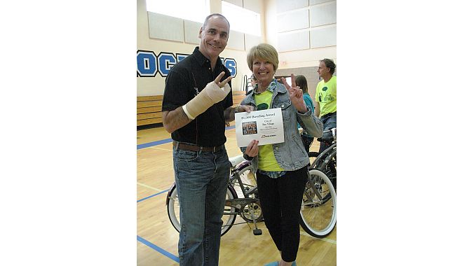 Chris Speyer celebrates Raleigh’s $2,000 award to the city with Bay Village Mayor Deborah Sutherland.