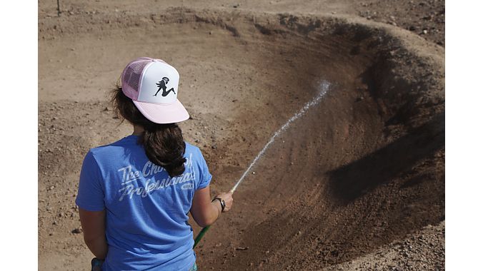 Bell's Courtney Dimpel waters the Bell pump track.