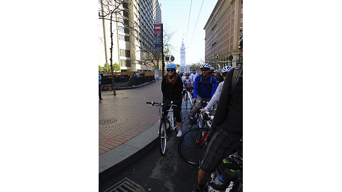 The group pauses on Market Street.