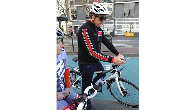 Action Sports International president Pat Cunnane multitasks in one of San Francisco's many new green-lane "bike boxes."