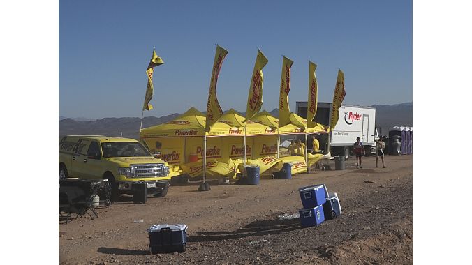 Late-day wind ripples the flags at PowerBar's trail-side tent.