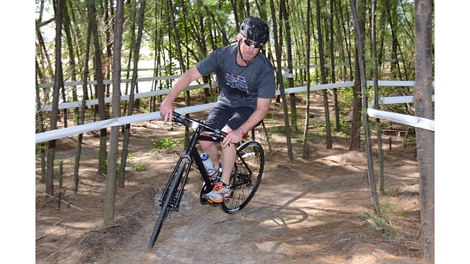 PeopleForBikes' Charlie Cooper tries out the Mary Jane trail on a slick-tired flat-bar bike. The trail is part of the Key Biscayne North trail system, which is one of the only mountain bike areas near Miami. After years of trying to get the trails built, Mary Jane Mack of Mack Cycle funded the construction of the 9-mile trail system. 