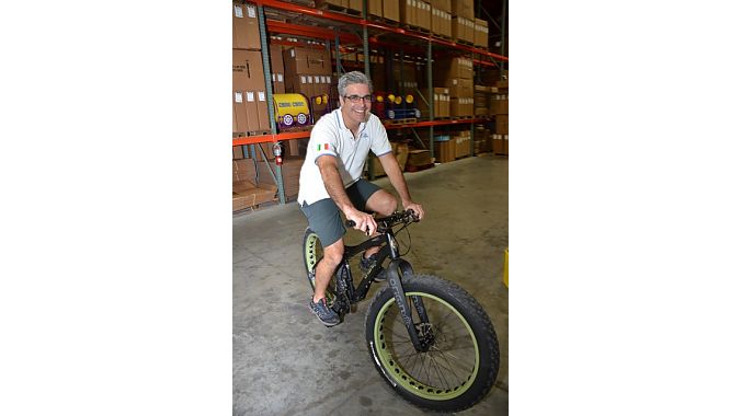 No Boundaries Sport owner Nico Stasi tries a fat bike in J&B Importers' warehouse Tuesday evening.