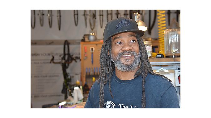 Shop and bar manager Dread Fiyah also does drafting work for The Spoke Easy owners' architectural design business, Cluck Design Collaborative, housed in the same building.