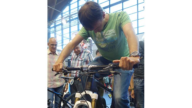 Shimano's display has been overrun all week with folks looking to try the new XTR Di2 shifters. There was a line to use one of the stationary trainers and for the counter-mounted display.