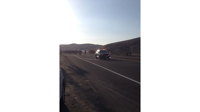 Riders head back to Jax in Irvine under police escort.