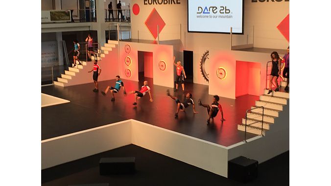 Dancers rehearse for the Eurobike Fashion Show, a longtime fixture at the trade exhibition.