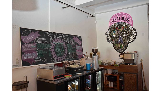 Fast Folks’ café serves coffee and mostly vegetarian and vegan fare—including vegan ice cream. It has also has décor created by local artists, whose work can be found throughout the shop.