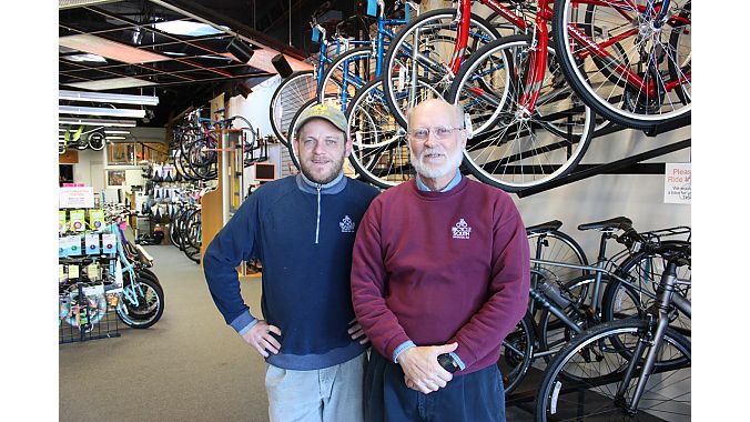 Fred Boykin (right) is retiring after 43 years in bike retail. Manager Brian Dunne (left) is acquiring Boykin’s shop, Bicycle South in Decatur, Georgia.