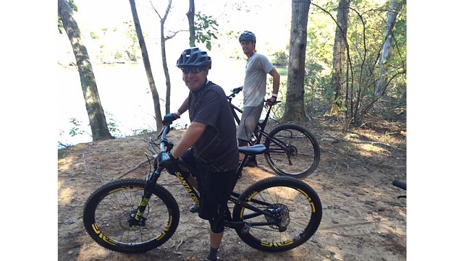 Bill Rudell (foreground) and Alex Sandella of CycloFest exhibitor G-Form take a lakeside break on the trail network at the U.S. National Whitewater Center.