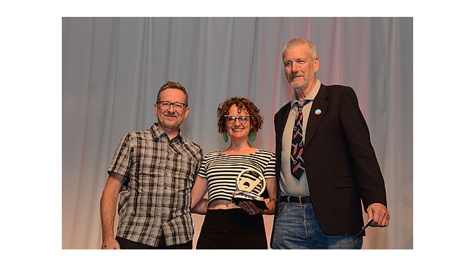 Flanked by the Mann Group’s Dan Mann (left) and BPSA’s Ray Keener, Gladys Bikes owner Leah Benson of Portland, Oregon, accepts the Interbike Award for Best Women’s/Female-Friendly Shop during a gala the closing night of the show. Thirty-six awards were handed out at the inaugural honors.