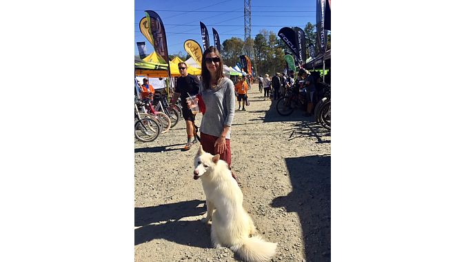 Beginner mountain biker Angela Greenwell traveled from Atlanta with her dog Beso to scope out Cyclofest and look at helmet options.