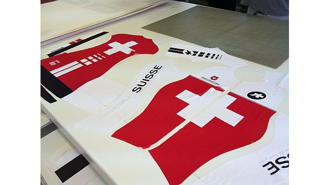 Assos manufactures custom team kit and prototypes in Stabio. This sublimated fabric was being cut for the Swiss world championships team.