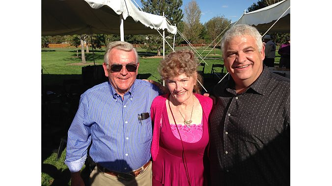 Gene Smith and Scott McCaskey flank Kay Cohen, Howie's widow.