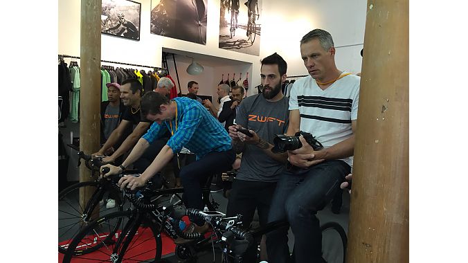 Neil Shirley of Road Bike Action, Caley Fretz of Velo, and Ben Delaney of BikeRadar.com demo Zwift's gaming based software at the Tuesday media event.