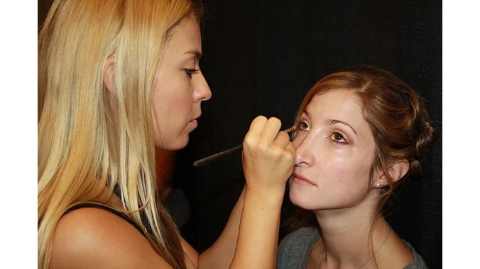 A model prepares for the Momentum fashion show