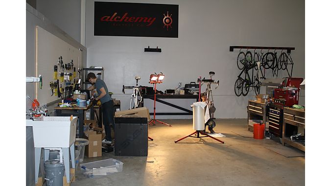 Chroma Fab shares space at Alchemy's headquarters. In this photo from Wednesday, a worker at Alchemy is prepping two bikes for NAHBS. Photo: Steve Frothingham