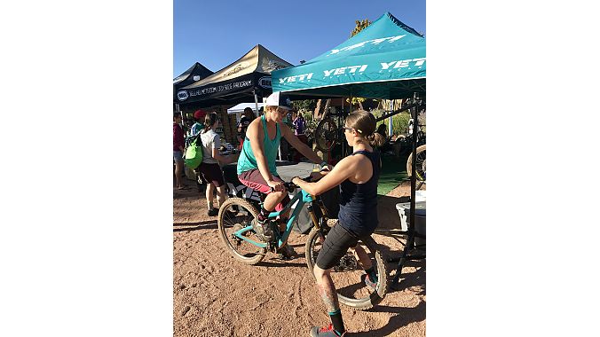 Yeti Cycling’s Jamie Armitage sets up a Yeti Beti demo bike for Jenny McConnell, who lives in Girdwood, Alaska. 