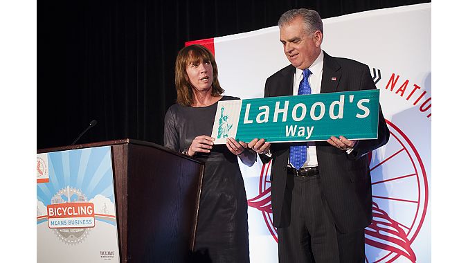 New York City Transportation Commissioner Janette Sadik-Khan presents outgoing U.S. Transportation Secretary Ray LaHood with an honorary NYC street sign.