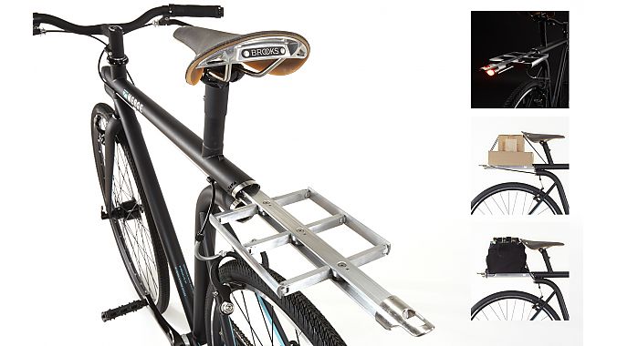 The NYC bikes has a spring-loaded retractable rear rack with integrated bungee and lighting.