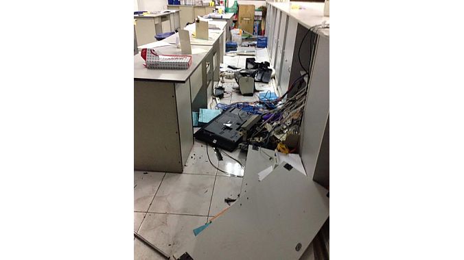 Rioters stole computers, smashed monitors and destroyed manufacturing equipment.