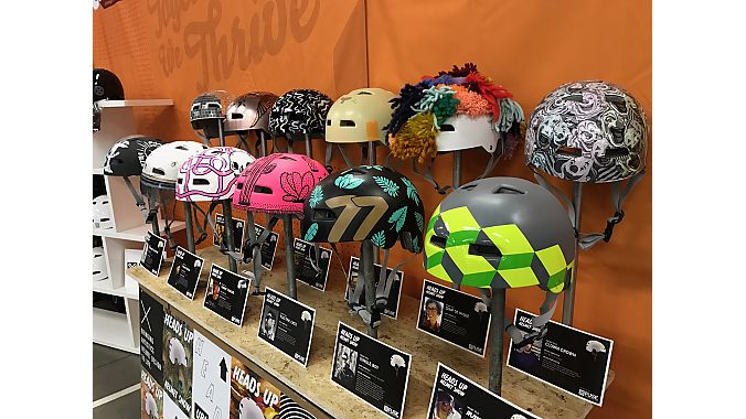 QBP staff spent weeks decorating helmets to show off its creativity in teh Heads Up helmet show at Frostbike's helmet showcase booth.