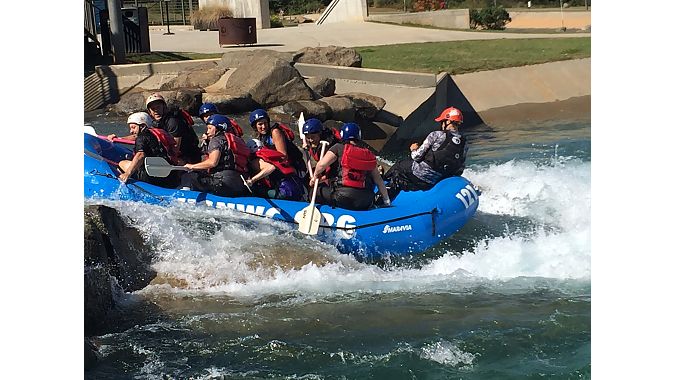 The Interbike crew does some team-building on the Whitewater Center's man-made rapids.