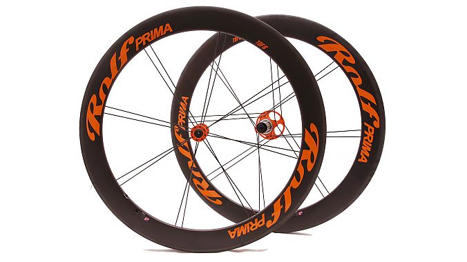 A Built on Demand wheelset with orange hubs and decals.
