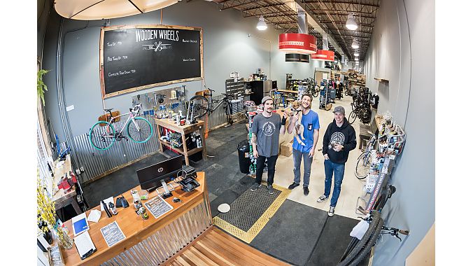 Wooden Wheels employees David Ferguson (left), Robbie Downward (center) and Chris Denney (right) reopened the store in a new location in early April.